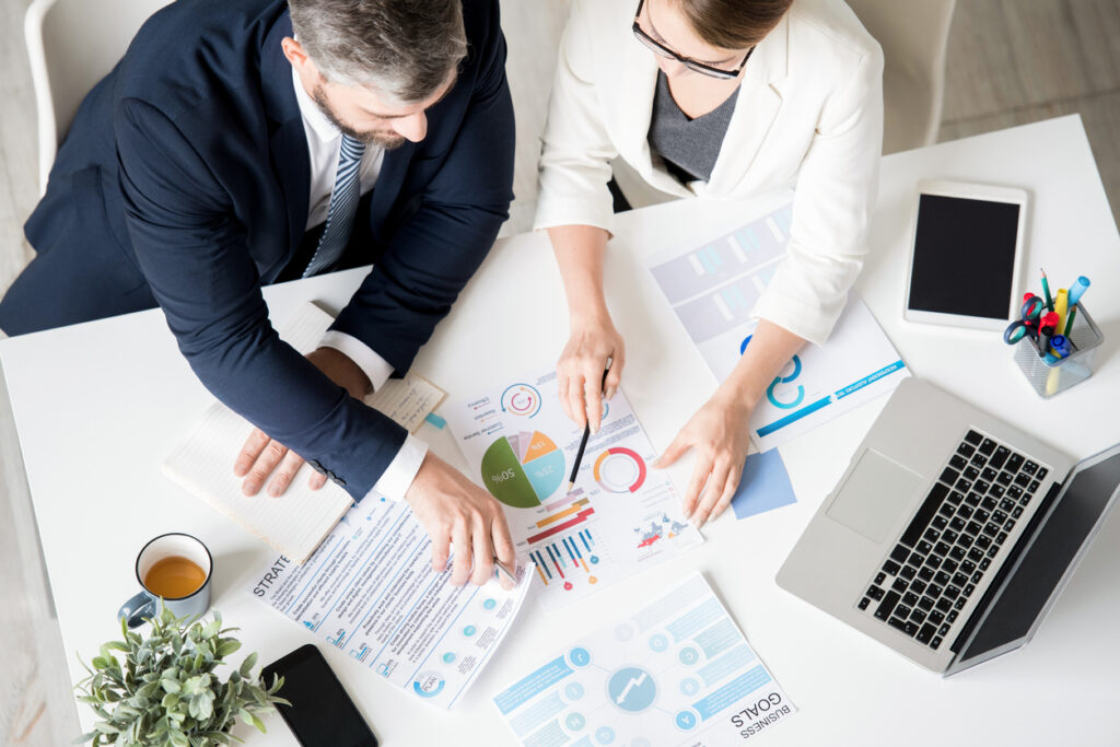 Business specialists analyzing progress while viewing charts | Marketing Direction | Digital Marketing Agency | Tampa - St Pete FL