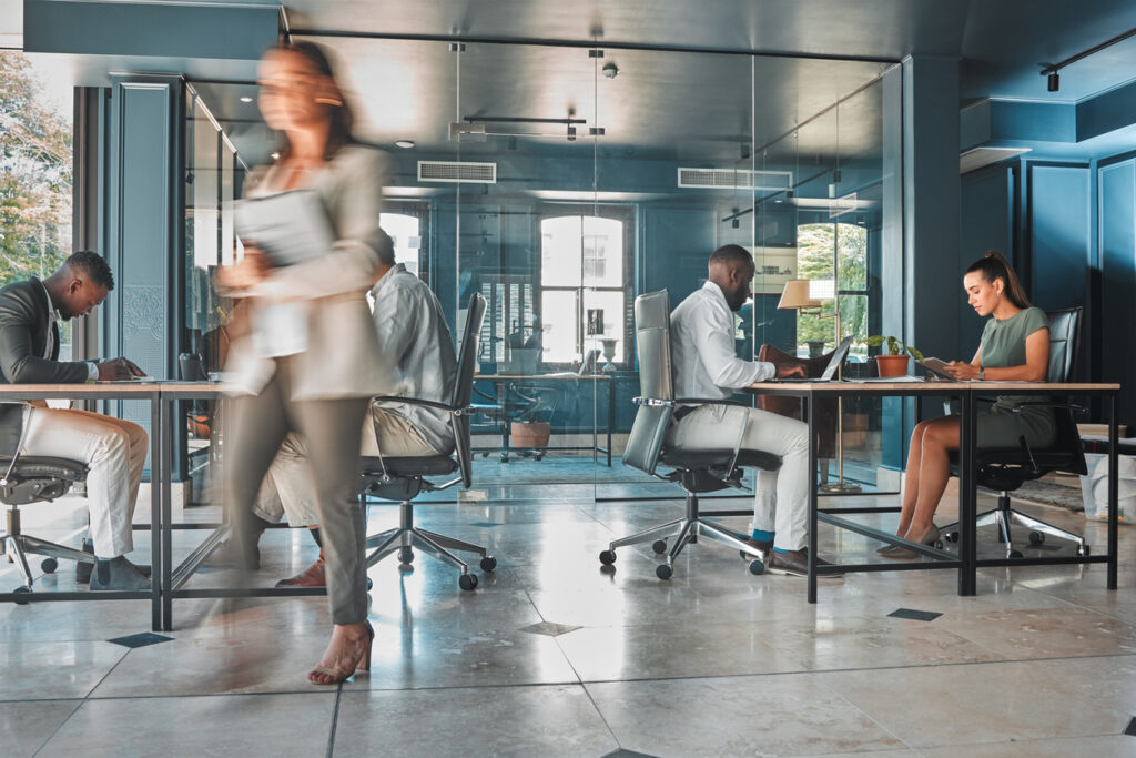 Work process of busy corporate team of business people working at startup marketing company planning email on laptop and sitting at desk in office Blur of employees workers and businesspeople | Marketing Direction | Digital Marketing Agency | Tampa - St Pete FL