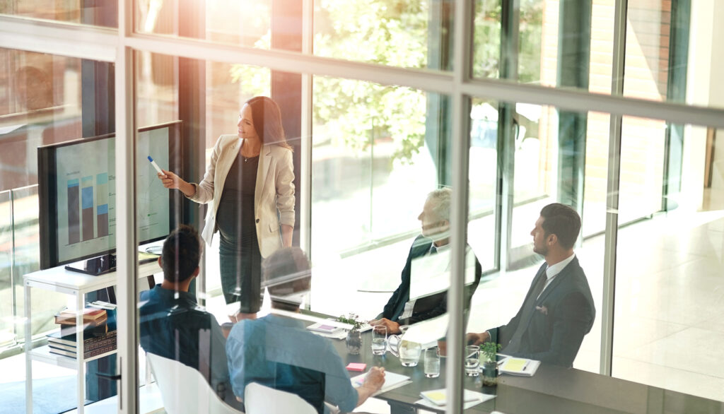Business woman presentation and conference room glass with collaboration and digital chart Speaker financial and accounting data with workshop and presenter in office with company stats review | Marketing Direction | Digital Marketing Agency | Tampa - St Pete FL