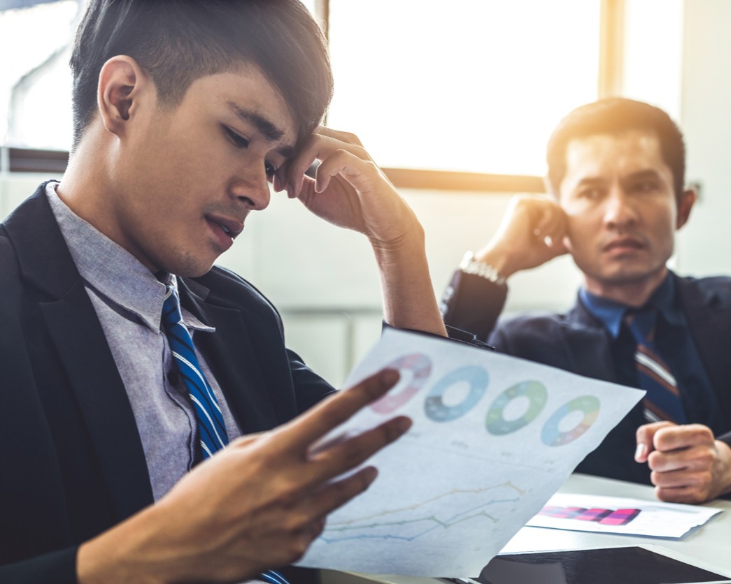 Choice Overload B2B Buyer Frustration Executive experiencing decision paralysis from too many B2B service options